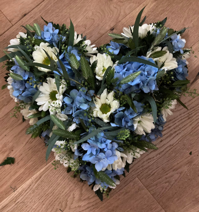 Blue & White Heart - Blue Hydrangeas and white Chrysanthemum with mixed foliage.
Photo shown is 12".