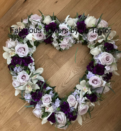 Lilac & Purple Heart Open Heart - A beautiful open heart with lilac Roses, Purple Carnations, white Orchids, lilac Hydrangea.